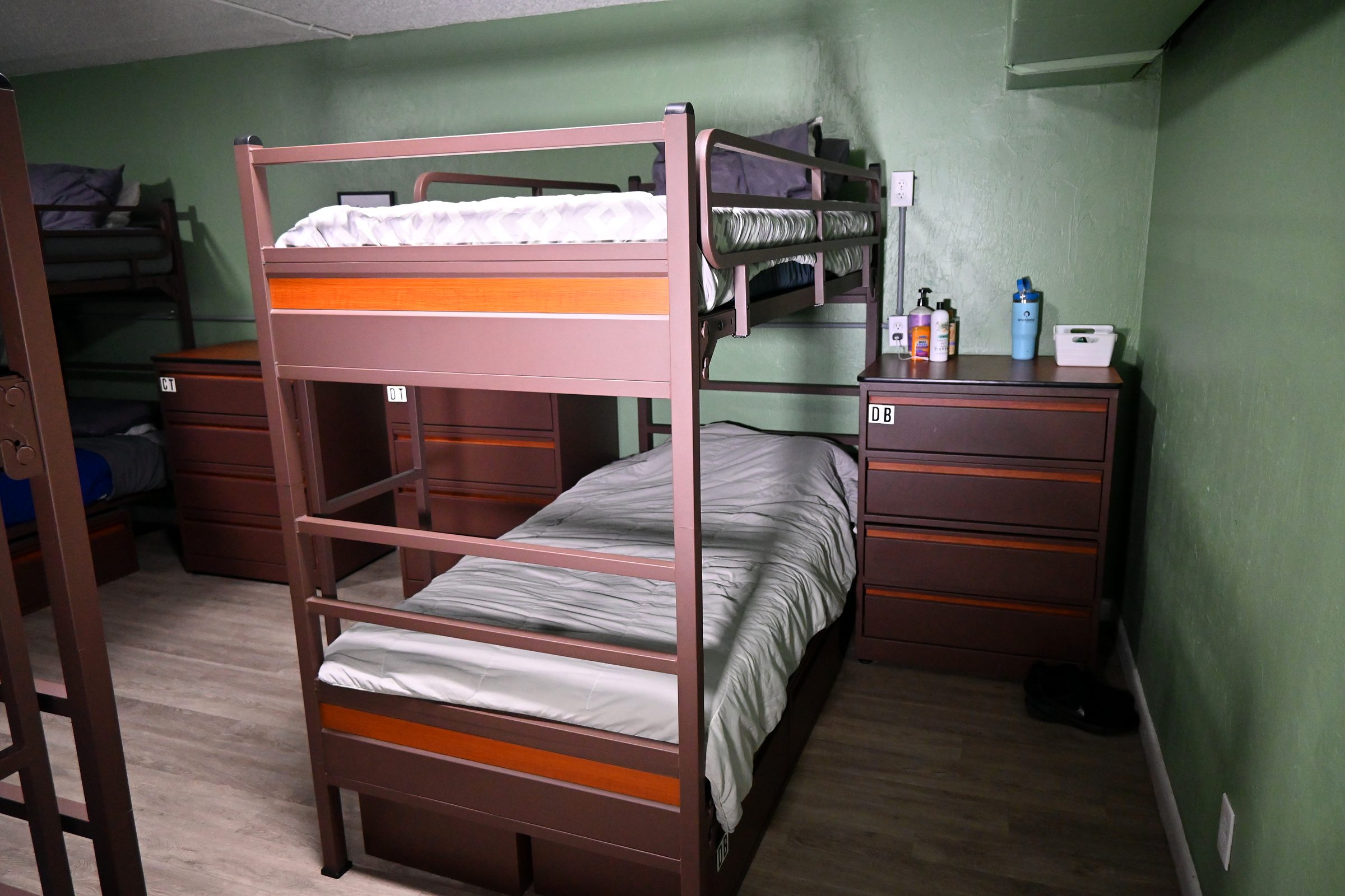 Bunk beds and dressers in a resident room