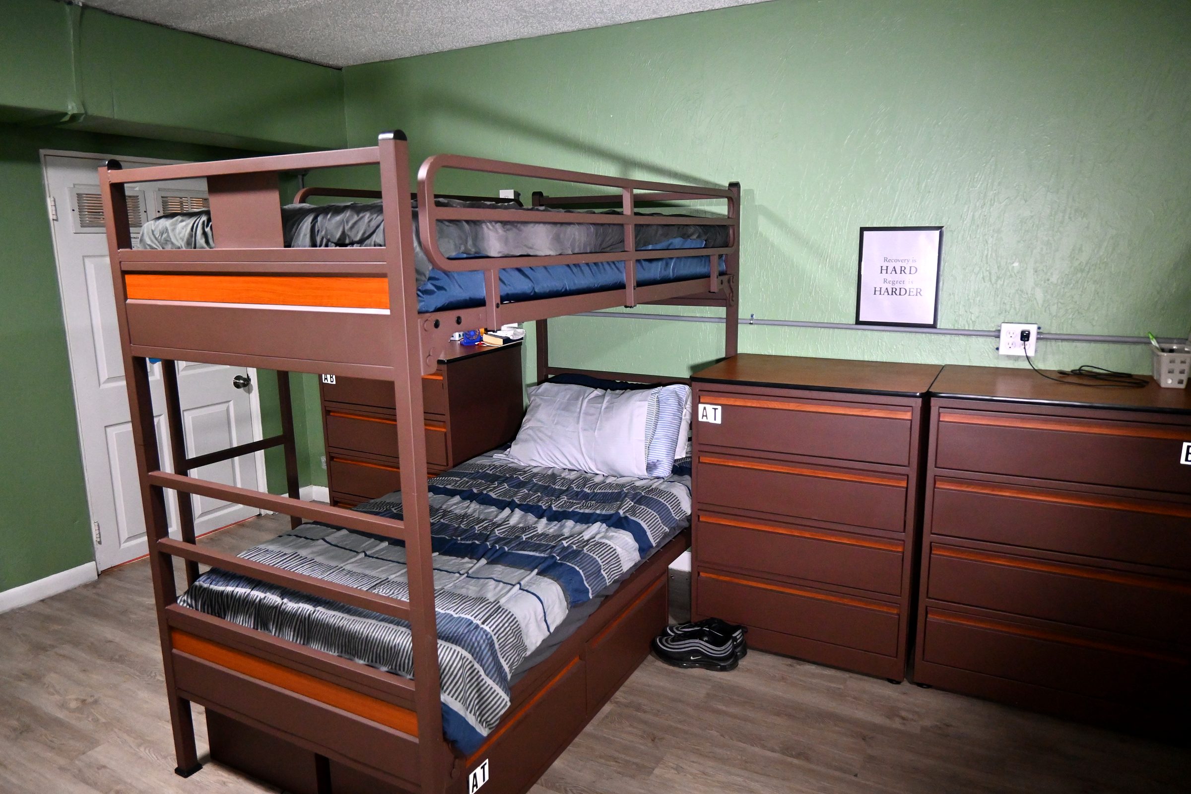 Resident room with bunk bed and framed print