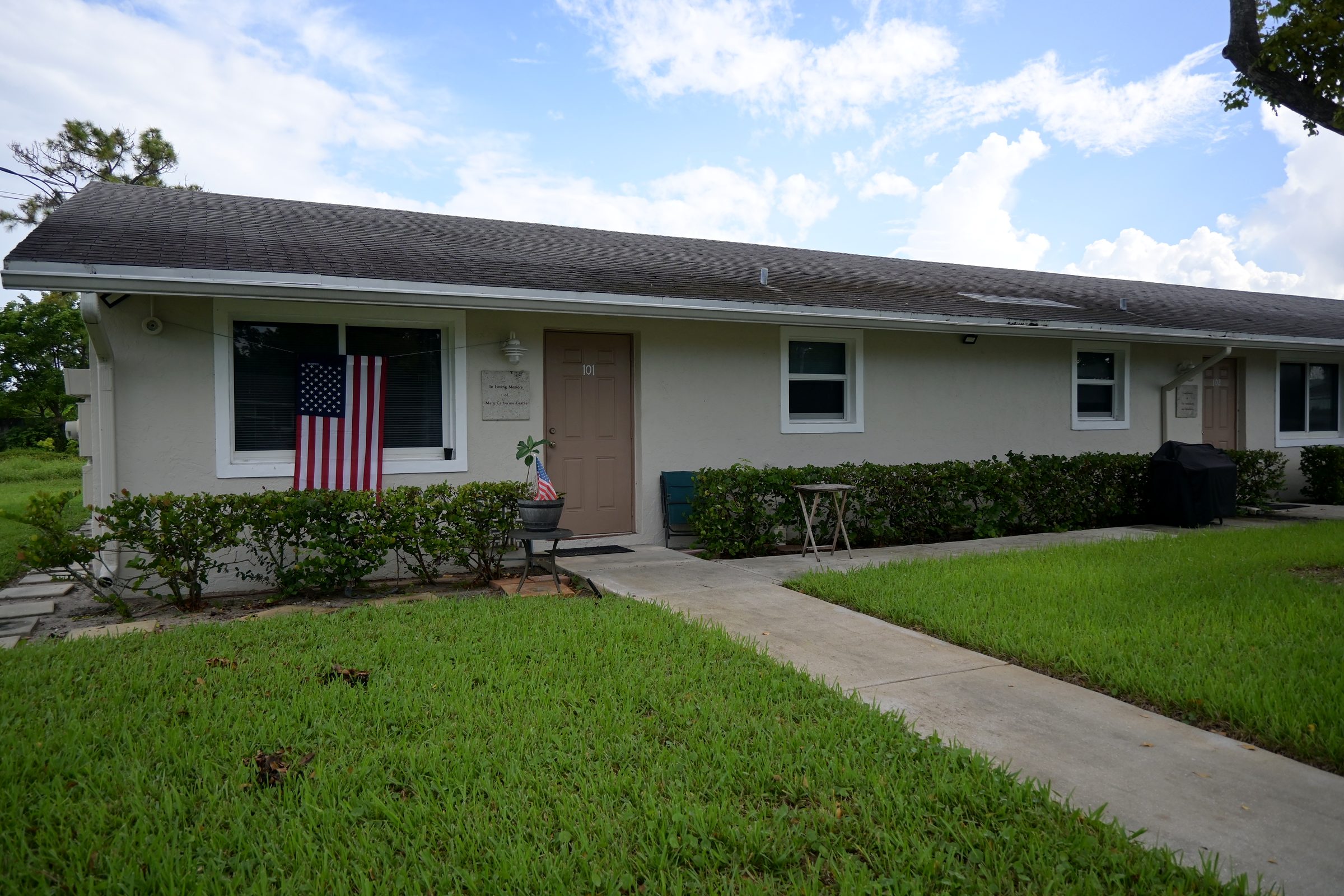 Resident unit with an American flag in the window
