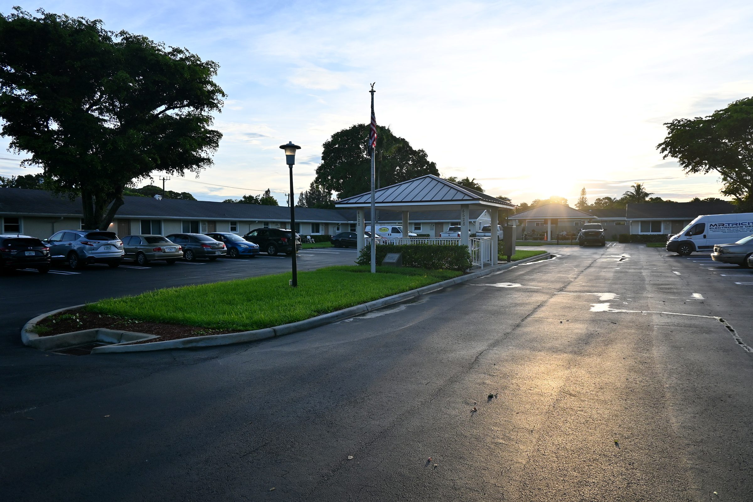 Sunrise over the entrance drive and flag gazebo
