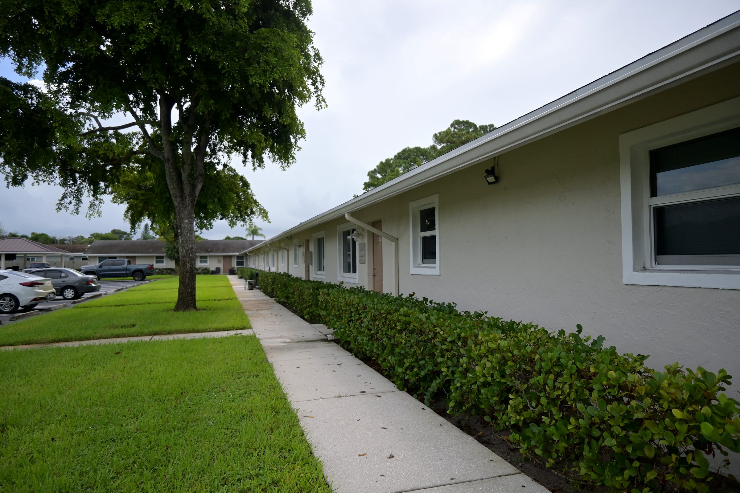 Shaded walkway along a residence wing